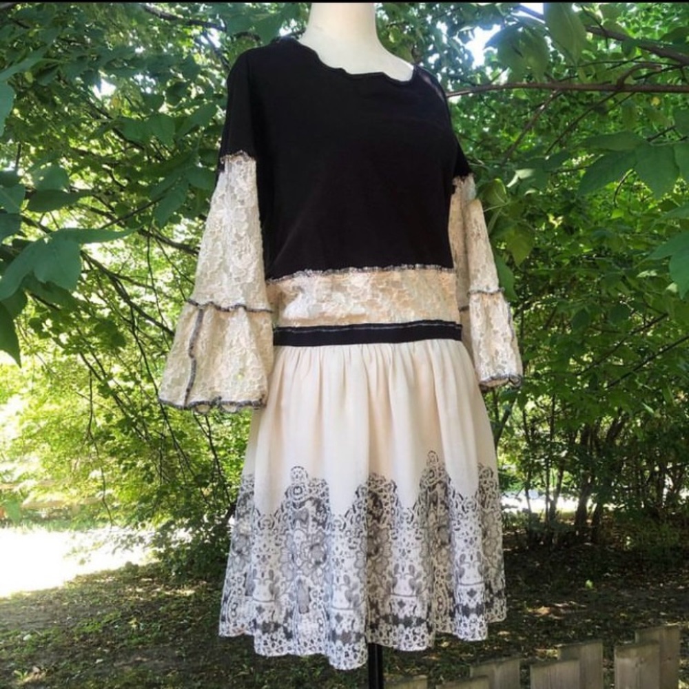 Upcycled tunic top with a waist panel and elegant black on cream print